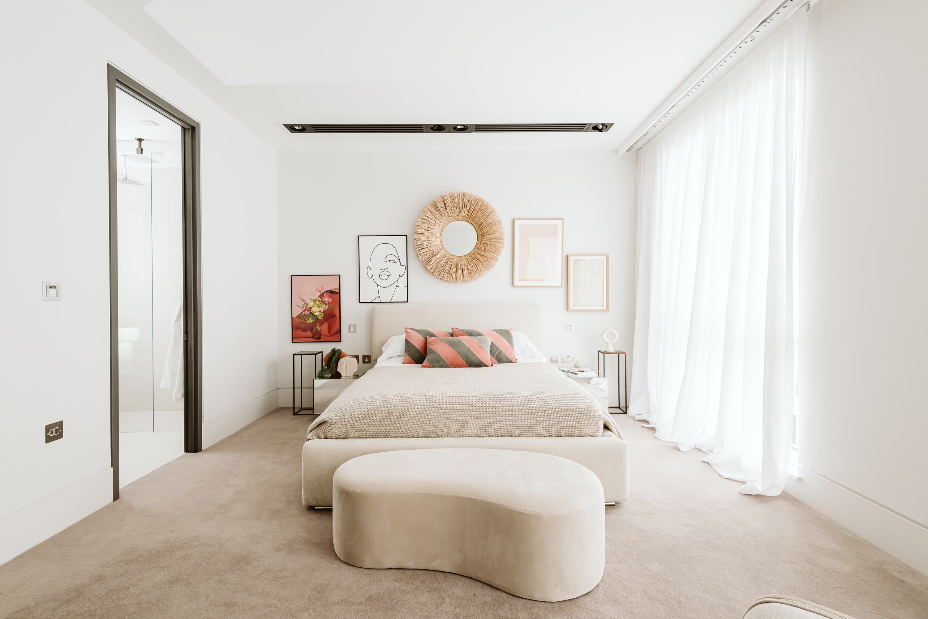 Styled London bedroom with gallery wall and natural light